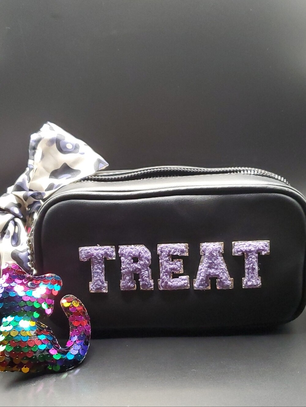 Betsey Johnson Black crossbody bag with "TRICK/TREAT text and plush cat charm